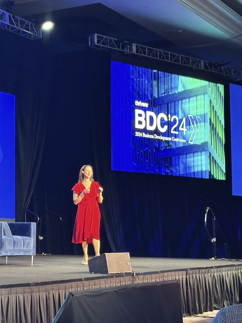 DawnMarie Montgomery speaking on stage at BDC'24